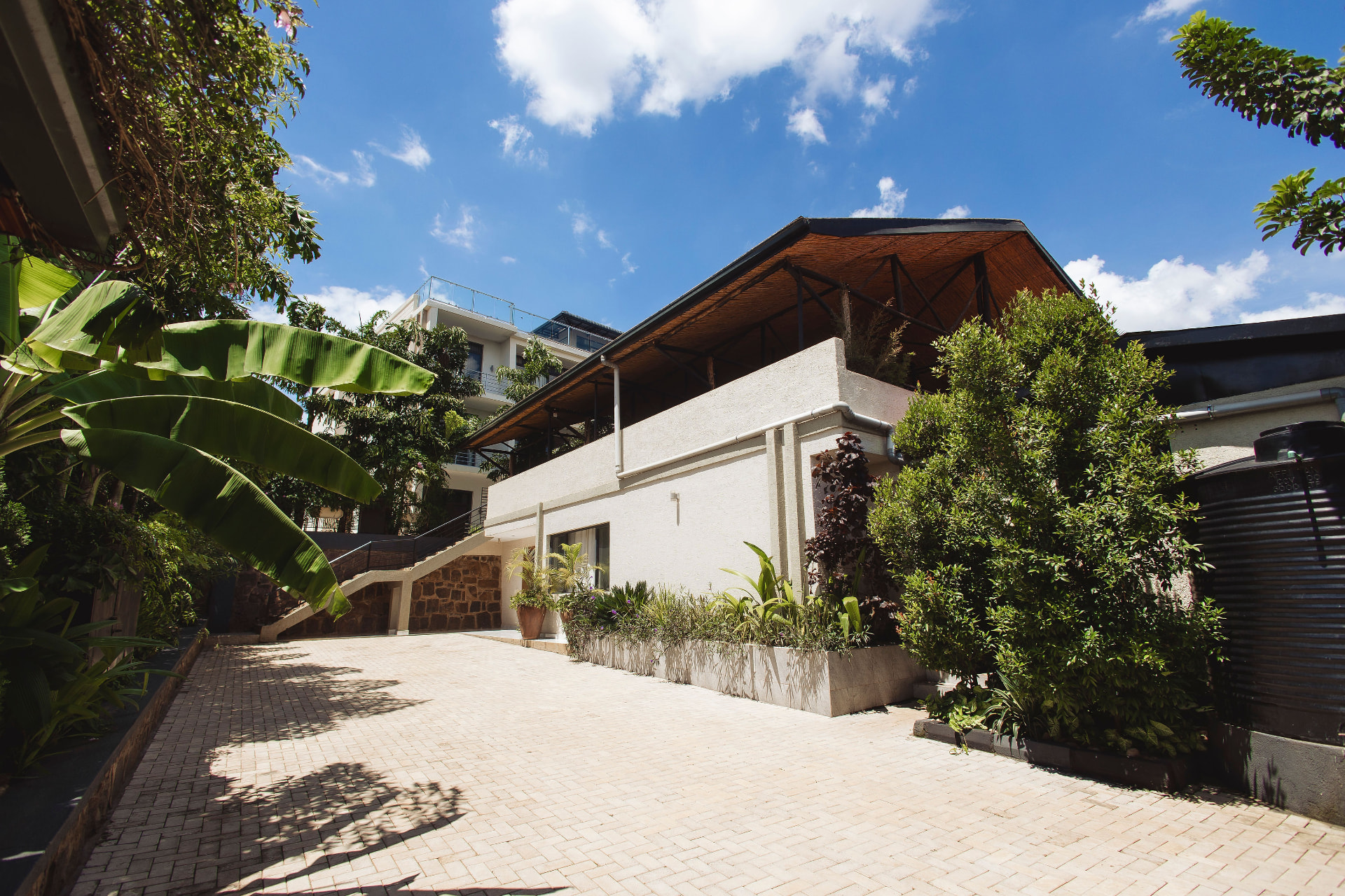 Paved driveway and landscaped grounds at ISUITE Apartments