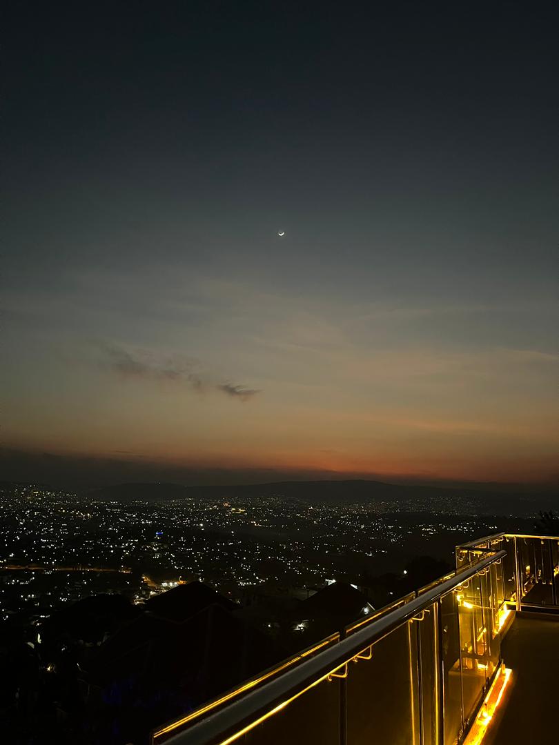 Night view from the balcony with lights across the valley